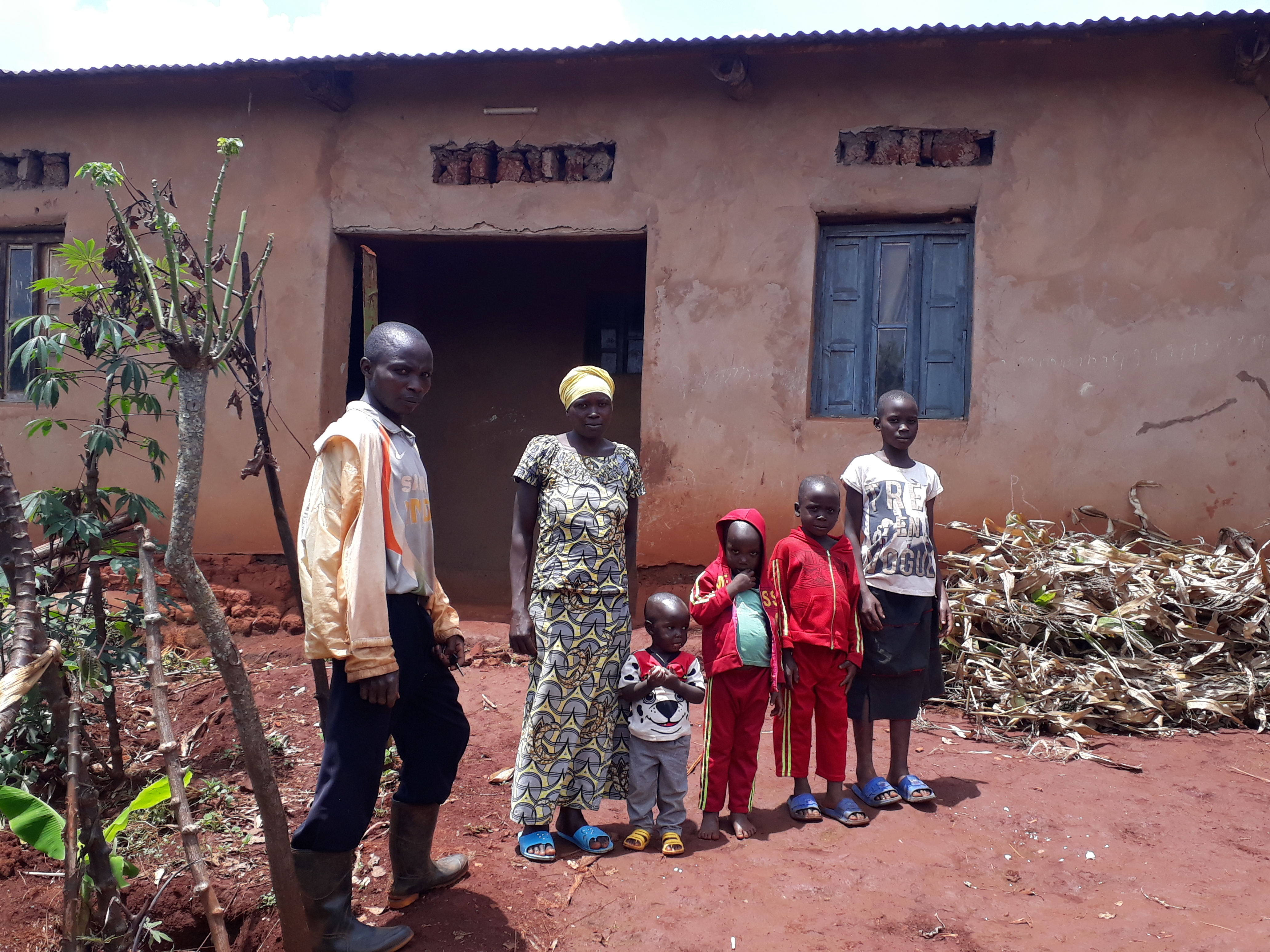 The solar panel Silas purchased with his new income from maize and bean sales at the local market keeps the lights on at his family home.